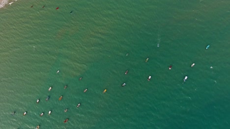 aerial view of traditional fishing boat moored in the turquoise sea of rio do fogo, brazil.