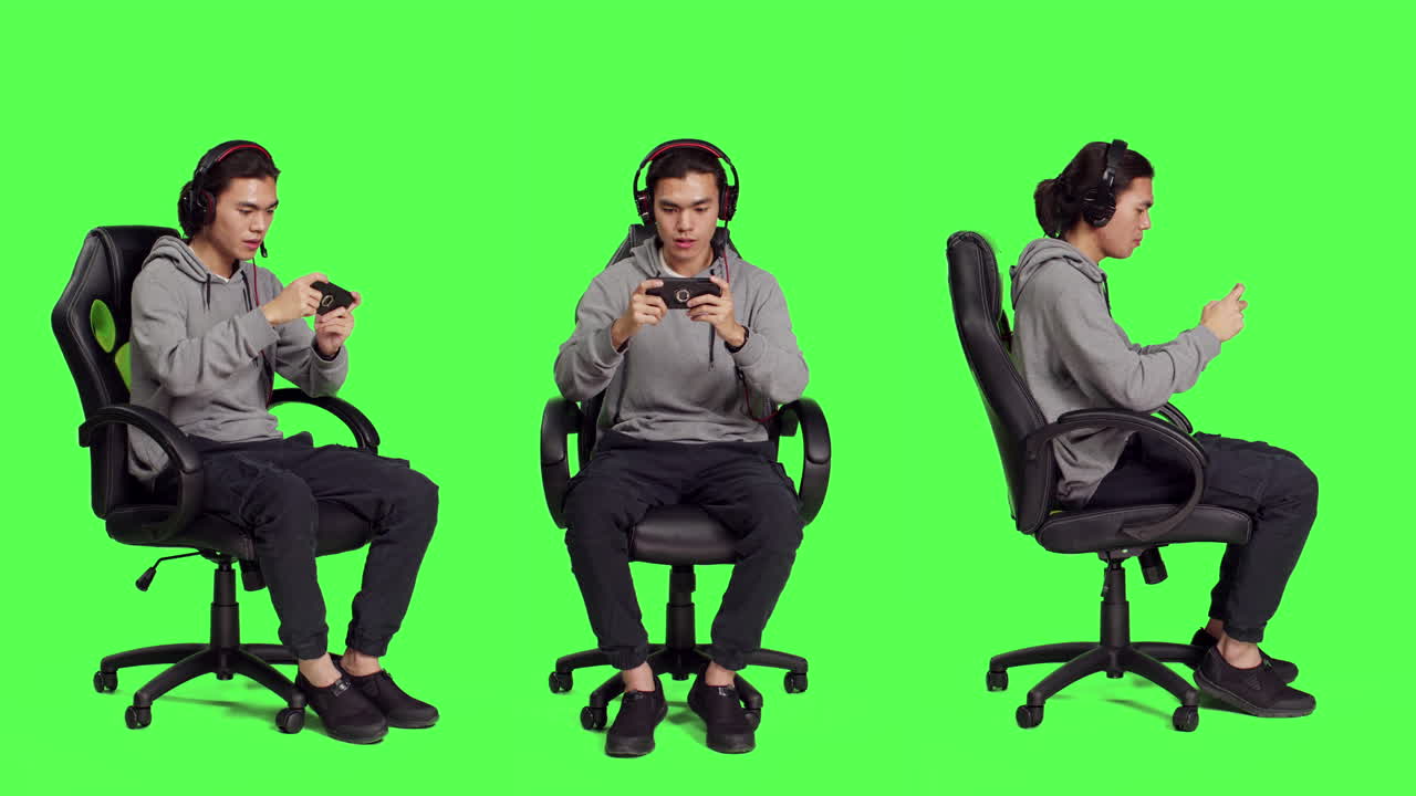 Asian Guy Sits In Chair Over Greenscreen Free Stock Video Footage Download  Clips