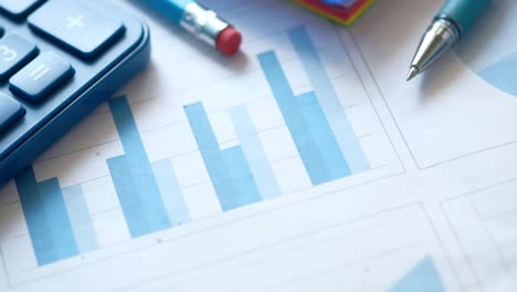 business documents with graphs and charts