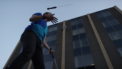 Slow-motion-knife-juggling-in-city