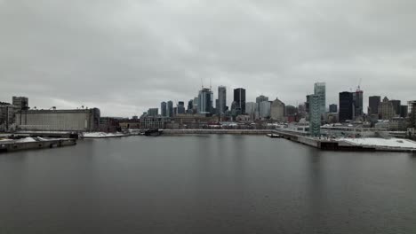 Drone-passing-through-small-crane-revelling-city-scape