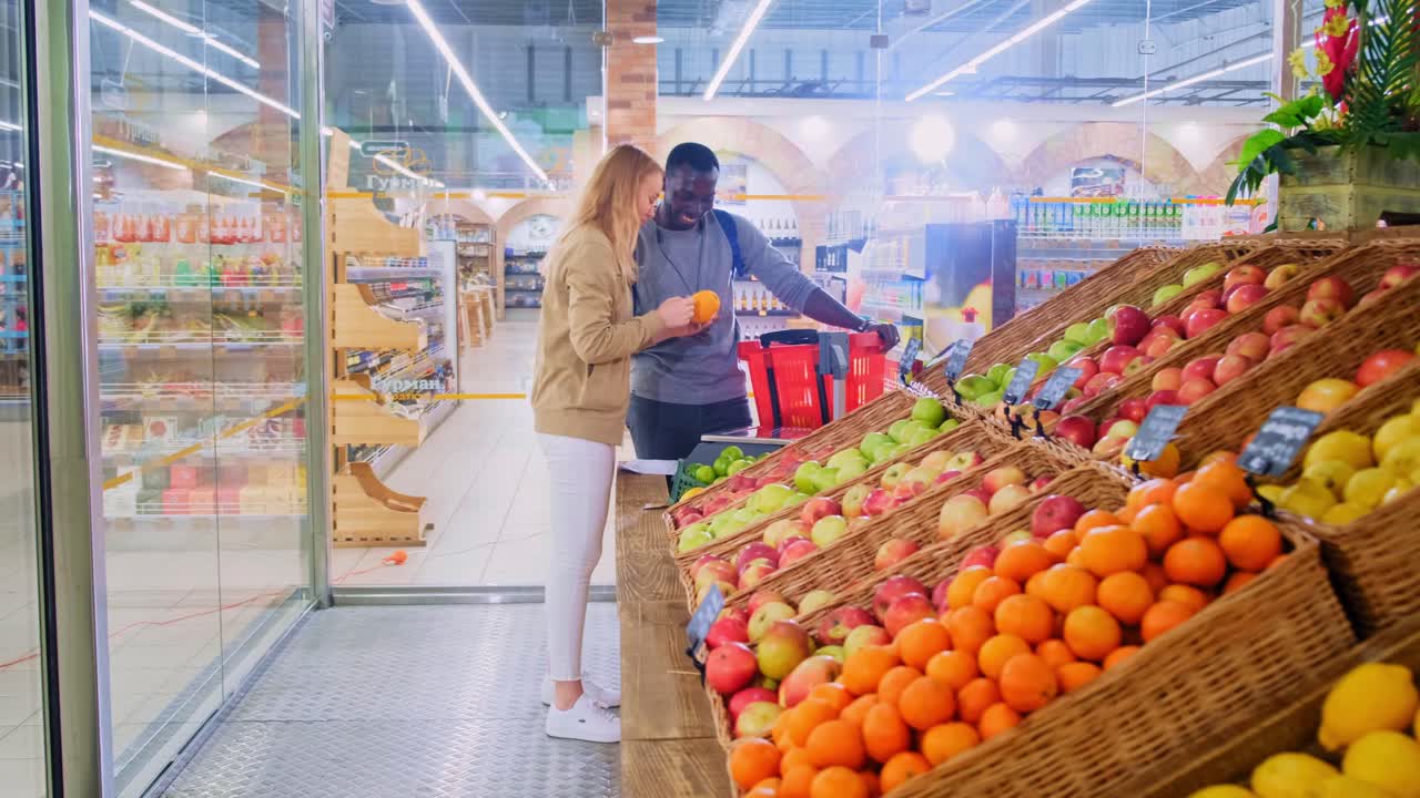 Exploring Fresh Produce: A Couple Enjoying Quality Time Together at a Local Grocery Store, Selecting Fruits and Vegetables for Their Next Meal