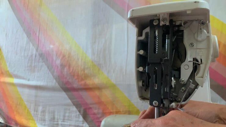 Sewing machine at home making clothes inner part visible
