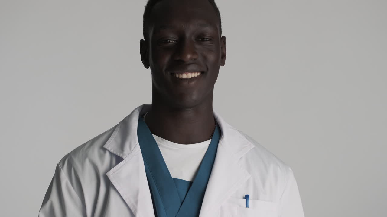 African american doctor on grey background.