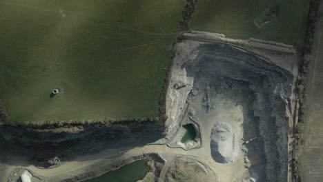 trucks and heavy equipment working at the quarry of construction aggregate supplier in rathcoole, dublin, ireland