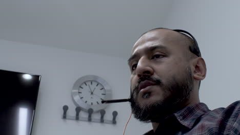 close up shot of man face talking in microphone