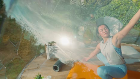 joven asiática haciendo posturas de yoga