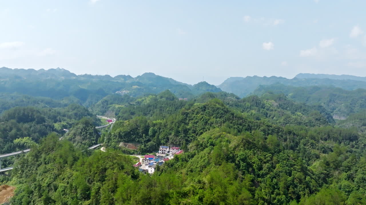 Drone rising over mountainous greenery of Zhangjiajie, summer day in China