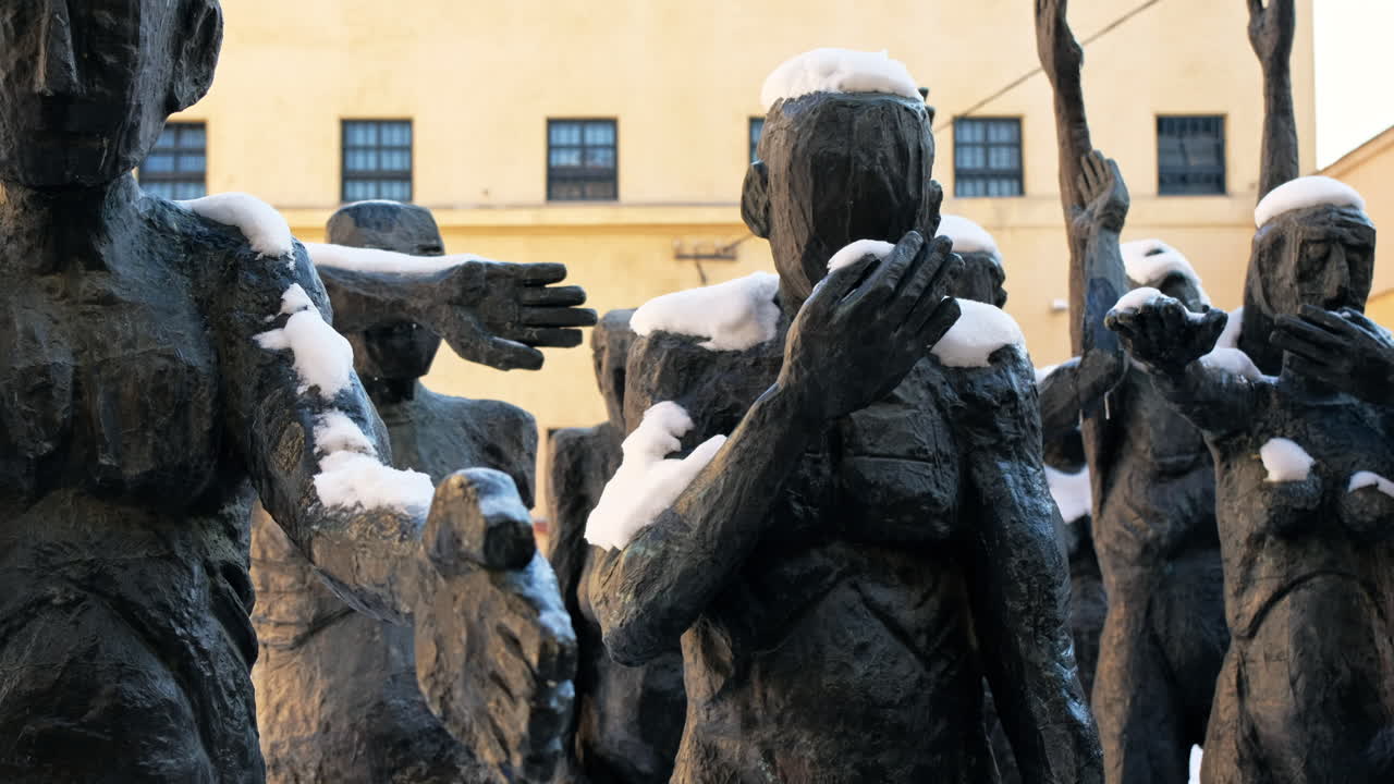 Memorial to the victims of communism and resistance metal statues in Sighetu Marmatiei in winter, snow, Romania