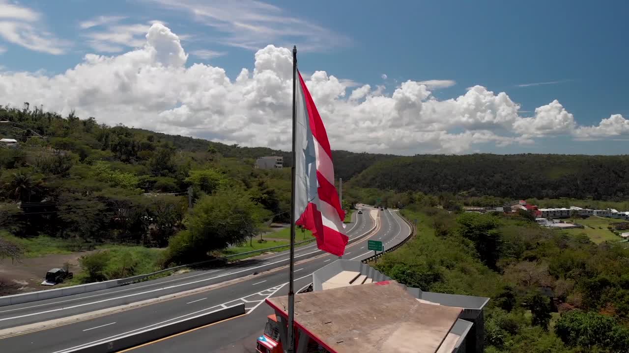 Puerto Rico Flag waving with the beach behind.