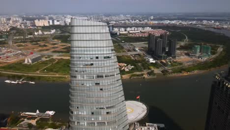 aerial view around the saigon skydeck, in sunny ho chi minh, vietnam - orbit, drone shot