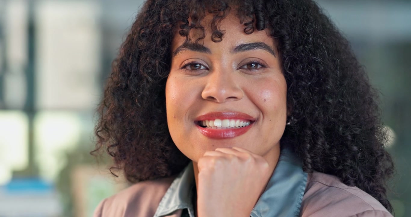 Portrait of a Confident Young Professional Woman Smiling in an Office