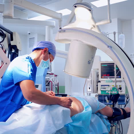 surgeon doing operation on patient's back. doctor in medical uniform performing surgery on a patient. real operating theater room. medical concept.