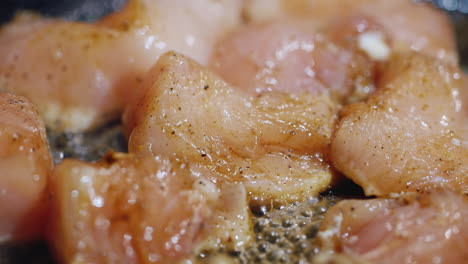 tender chicken with spices fried in a pan