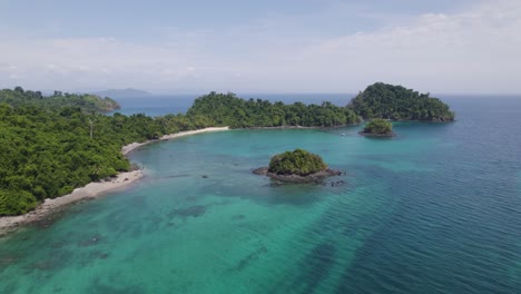 Aerial-view-of-turquoise-waters-and-lush-greenery-surrounding-Coiba-Island-and-Isla-Ranchería-in-Panama