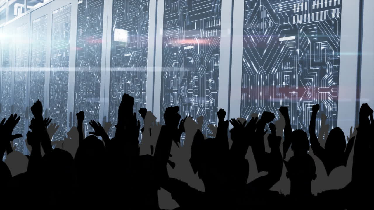 Cheering crowd in front of digital animation display with circuit board design