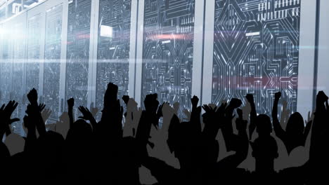 cheering crowd in front of digital animation display with circuit board design