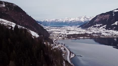 frozen zell lake in austrian mountain alps, aerial view in winter, snow covered