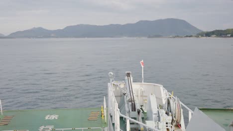 Setouchi-inland-sea-of-Japan,-Ferry-traveling-ocean-on-windy-day