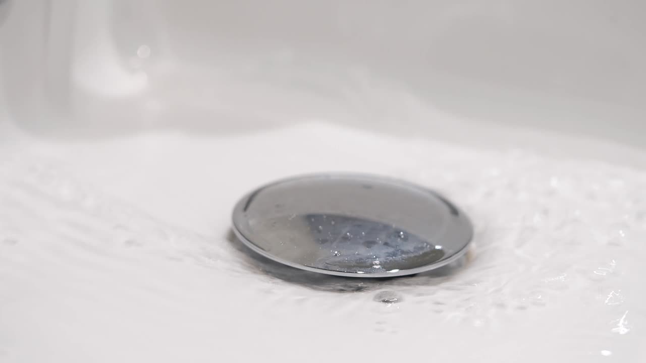 Water Draining into a Bathroom Sink