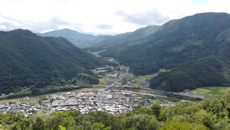 pan across asago valley and city on overcast day, rich japanese history