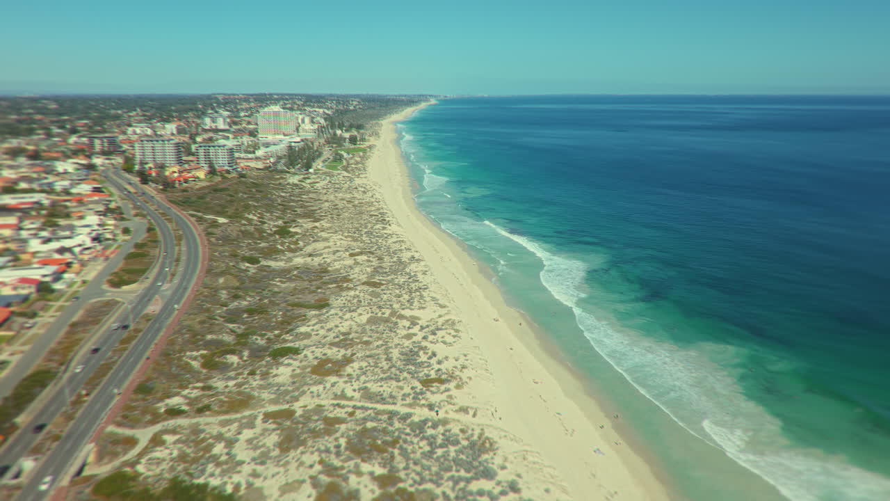 Aerial view of a beach with city and ocean