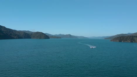 SLOWMO---Aerial-Shot-of-boat-in-Marlborough-Sounds,-New-Zealand