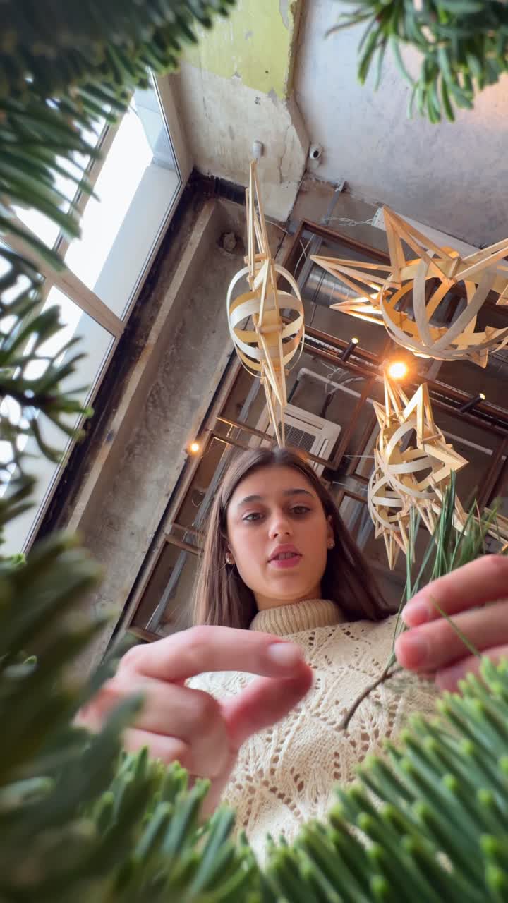 Woman Decorating a Christmas Tree