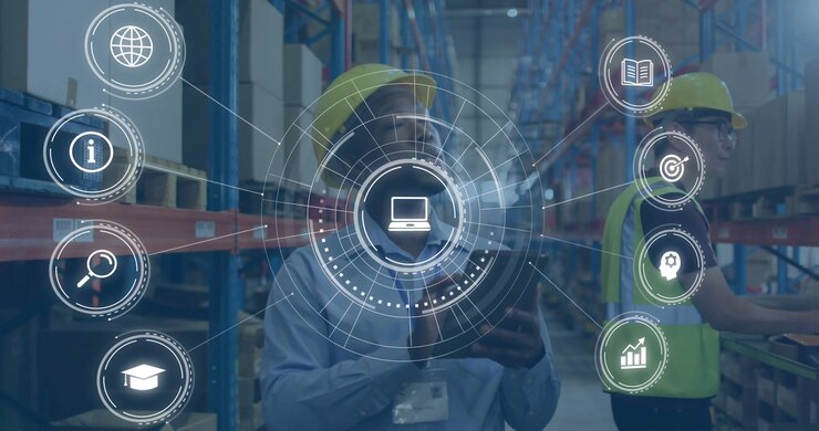 HUD appearing, male worker tapping tablet in logistics aisle and syncing stock with laptop user