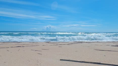 beautiful time lapse on a sunny day on a calm pristine beach with blue skies in north carolina in the outer banks in nags head during early summer