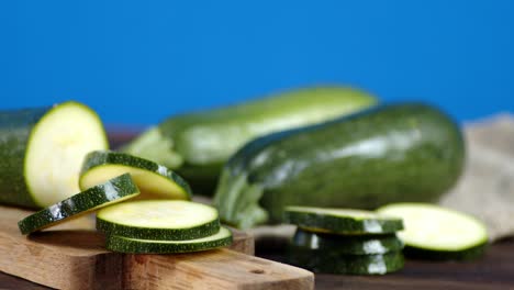 sliced zucchini on a cutting board rotates slowly.