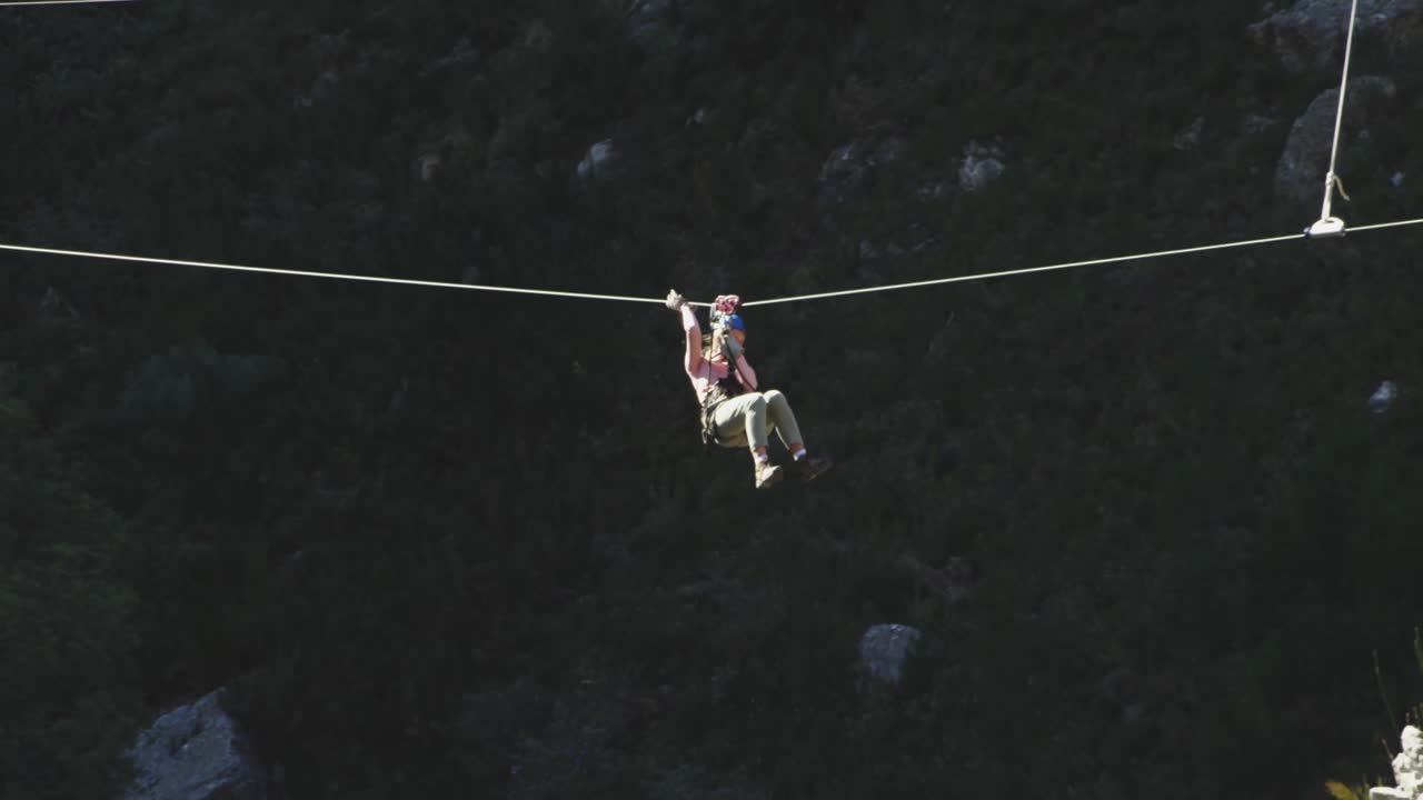 Young Caucasian man zip lining
