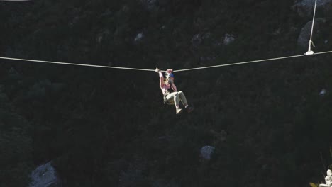 young caucasian man zip lining