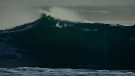 powerful ocean waves with surfers