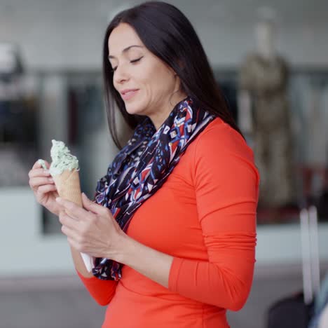 attractive young woman eating an ice cream cone