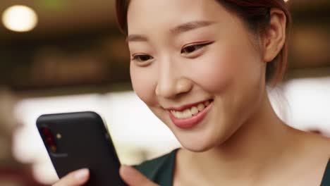 A Young Woman's Joyful Expression While Engaging with Her Smartphone, Captured in Two Frames from a Lighthearted Video Showcase