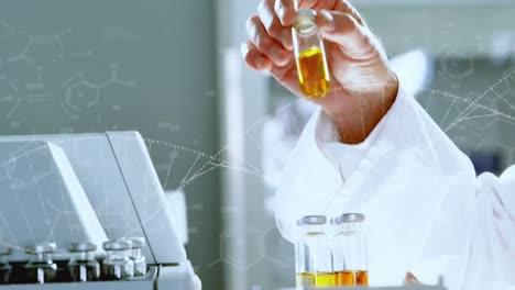 Animation-of-dna-and-chemical-structures-over-mid-section-of-a-male-scientist-working-at-laboratory