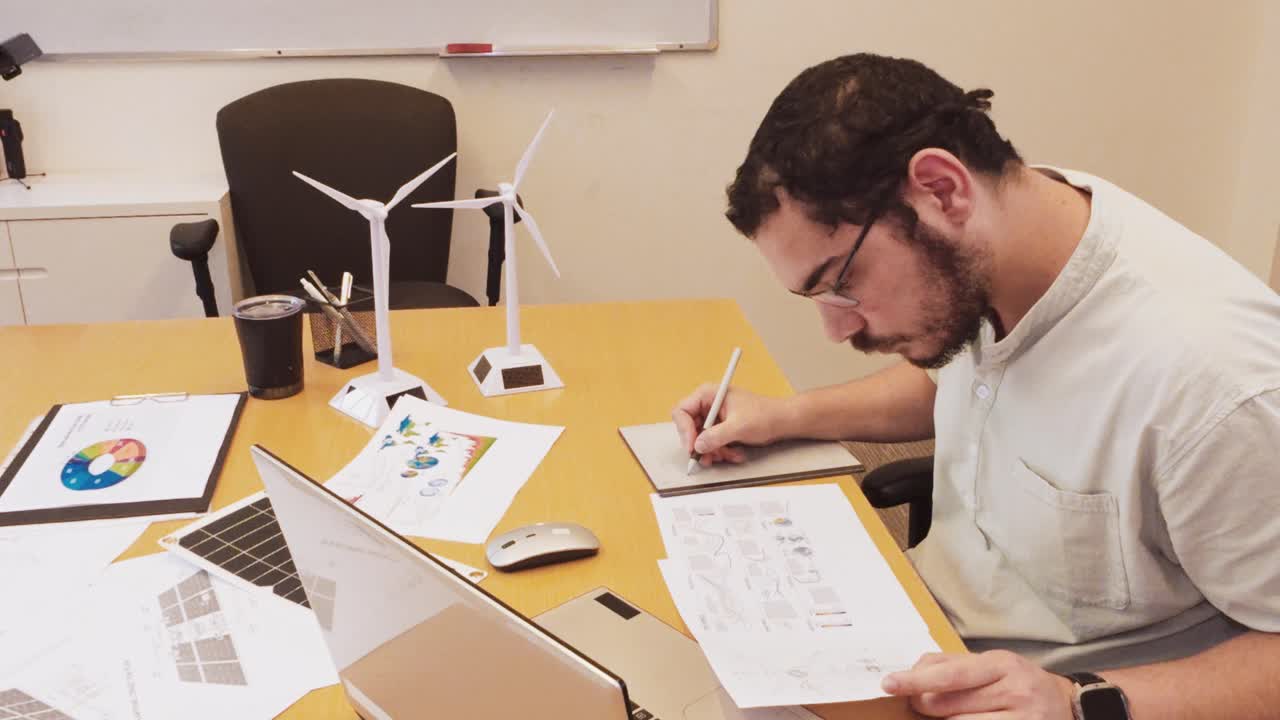 Focused Architect Making Digital Revisions on a Graphics Tablet