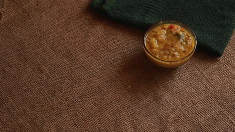 rotation-Chole-Bhature-or-Chick-pea-curry-and-Fried-Puri-served-in-terracotta-crockery-over-nice-background