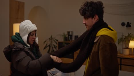 couple sharing warm winter clothes