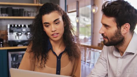 couple using laptop