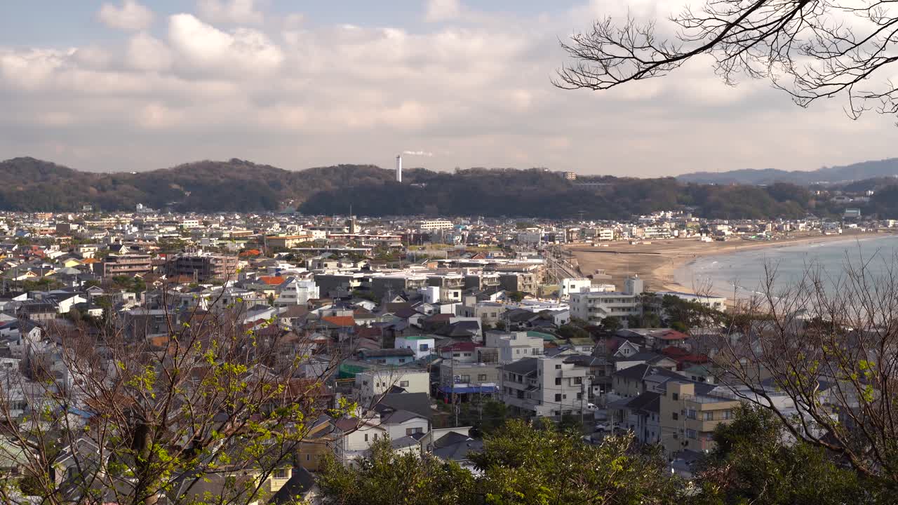 Wonderful View Of Unique Buildings and Trees With Calm Sea In Kamakura, Japan - Aerial Shot