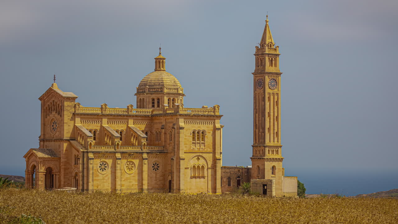 Timelapse of Bażilika Tal-Madonna Ta' Pinu Mill Gharb across field