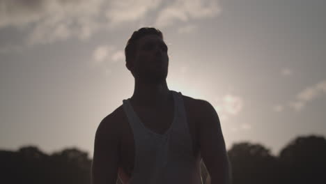 Young-Attractive-Man-Stretching-In-Park-Before-He-Works-Out---Ungraded