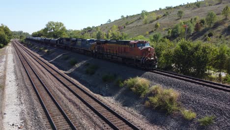 Drone-footage-of-a-train-driving-by-from