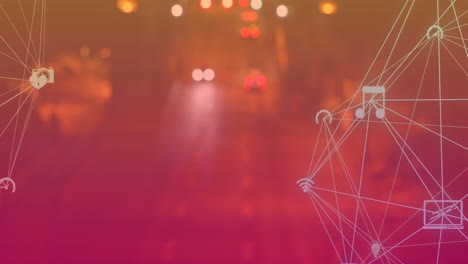 animation of globes of digital icons spinning against aerial view of night city traffic