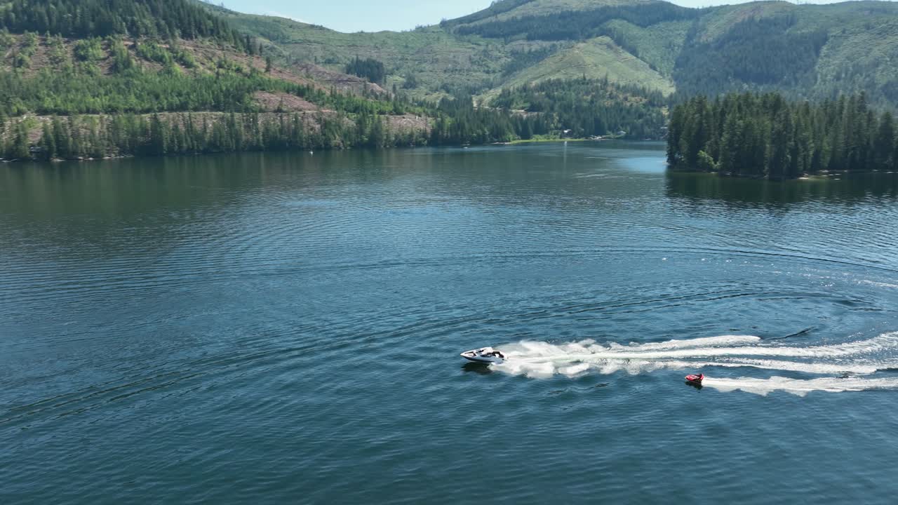 Aerial view of a motorboat pulling an inner tube on Spirit Lake, Idaho