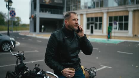 man on motorcycle talking on phone