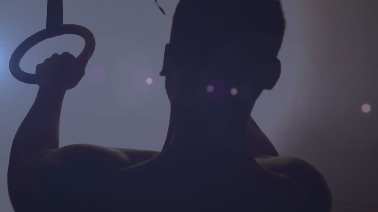 animación de la silueta de un hombre haciendo ejercicio con manchas brillantes de luz parpadeando en primer plano