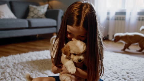 girl cuddling with a puppy